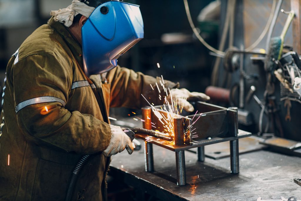 Industrial metal steel parts welding welder at the factory